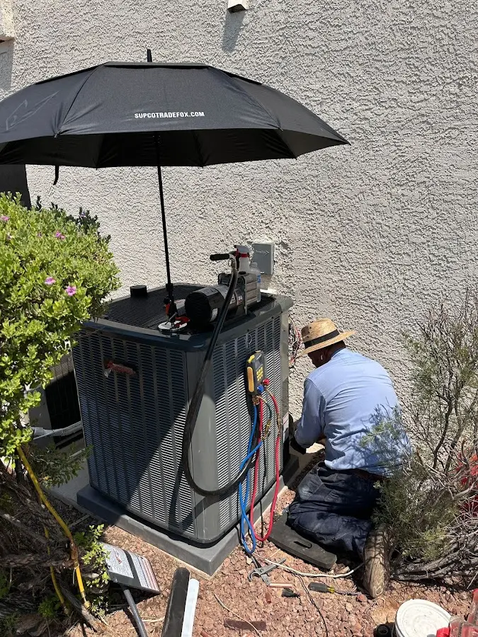 HVAC technician performing outdoor AC maintenance in Lake Forest